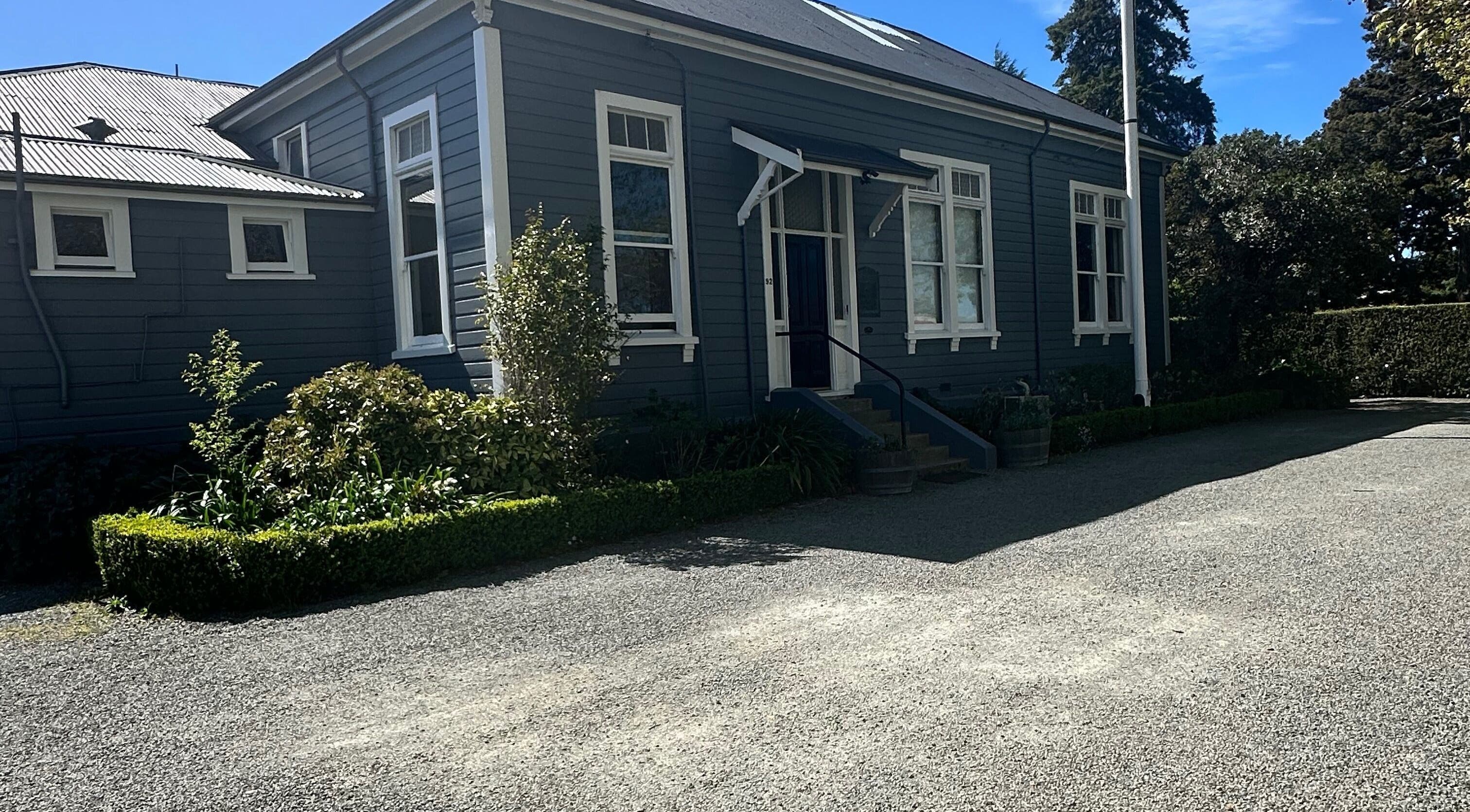 Front view of Alchemy Hair & Beauty in Blenheim, Marlborough Region, NZ showcasing its quaint exterior.