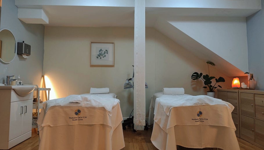 Relaxing therapy room at Meditation TaiChi TCM Health Centre in London, England, GB, with massage tables.