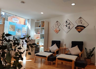 Calm seating area at Meditation TaiChi TCM Health Centre in London, England, GB with natural light and decor.