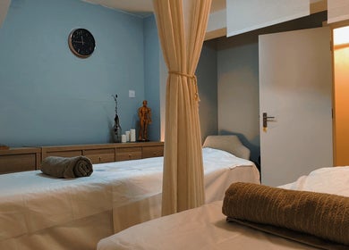 Calming massage room at Meditation TaiChi TCM Health Centre in London, England, GB with soft lighting and decor.