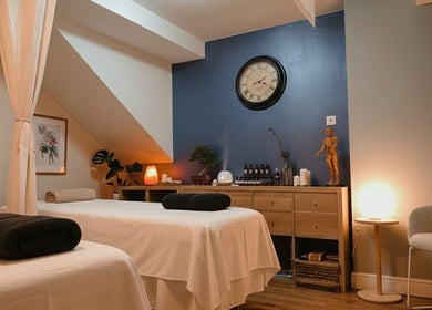 A tranquil massage room at Meditation TaiChi TCM Health Centre in London, England, GB with soft lighting and decor.