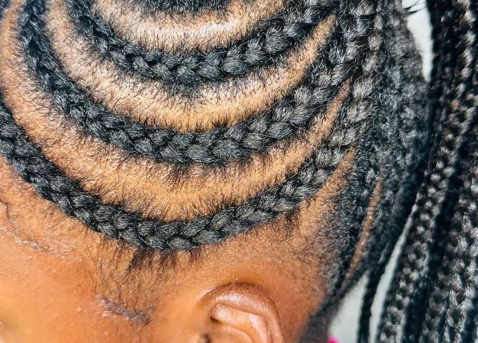 Intricate cornrow braids at Nthaby Pretty Kids Salon in Pretoria East, Gauteng, ZA, showcasing skilled artistry.