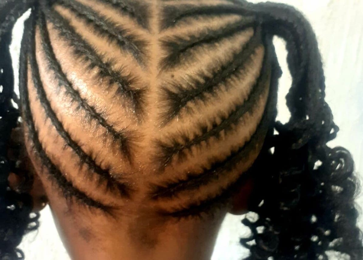 Intricate braided hairstyle at Nthaby Pretty Kids Salon, Pretoria East, Gauteng, ZA.