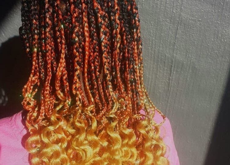 Colorful braided hairstyle for kids at Nthaby Pretty Kids Salon, Pretoria East, Gauteng, ZA.