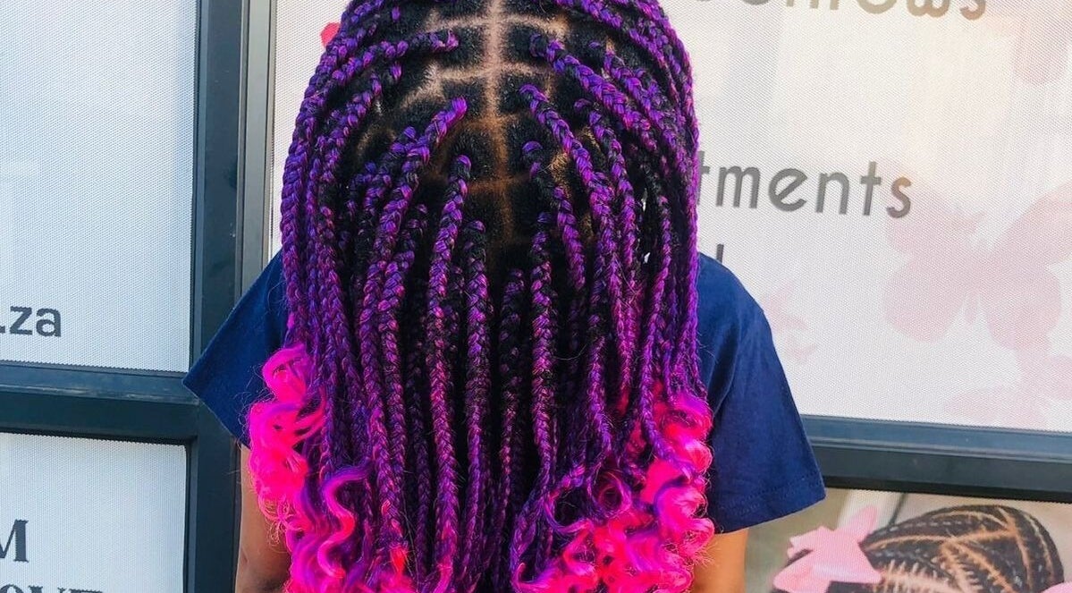 Colorful braided hairstyle at Nthaby PrettyKids Salon, Pretoria East, Gauteng, ZA.