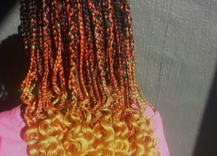 Colorful braids and curls hairstyle at Nthaby PrettyKids Salon in Pretoria East, Gauteng, ZA.
