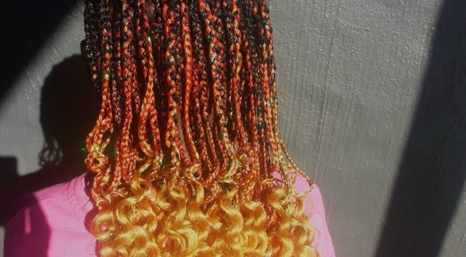 Colorful braids and curls hairstyle at Nthaby PrettyKids Salon in Pretoria East, Gauteng, ZA.