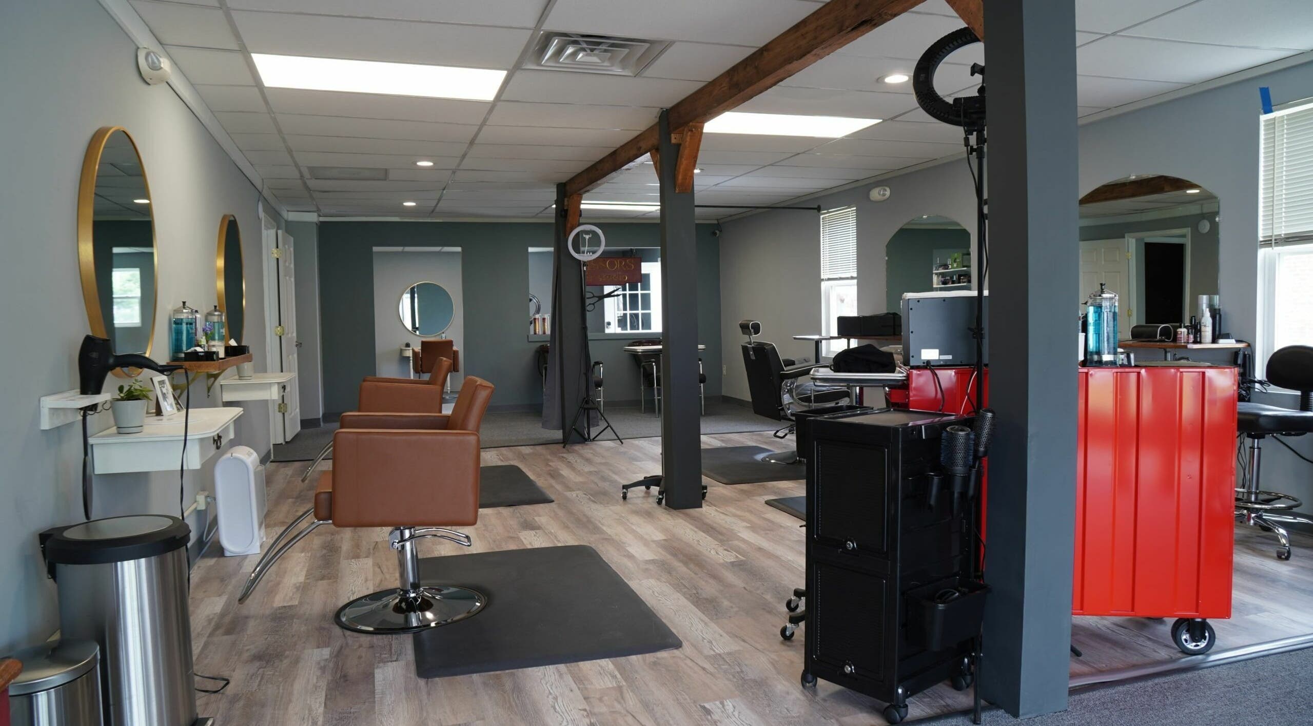 Modern interior of Scissors Hair and Barber in New Freedom, Pennsylvania, US, showcasing chic workstations.
