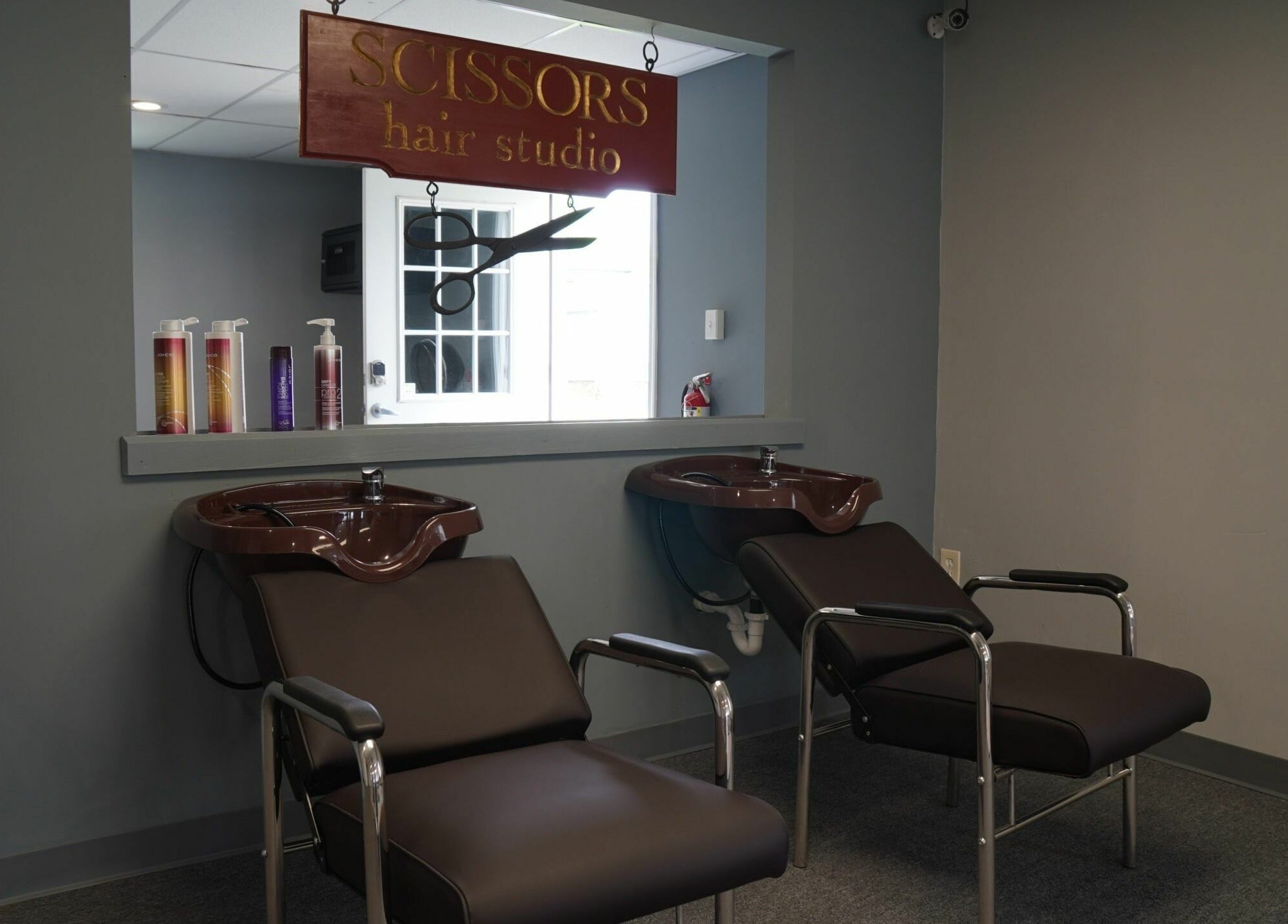 Modern wash stations at Scissors Hair and Barber, New Freedom, Pennsylvania, US.