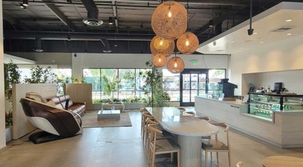 Relaxing lounge area at Skiness in West Hollywood, California, US, featuring modern decor and ample natural light.