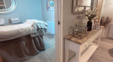 Calm treatment room at Hidden Gem Beauty- Congleton, Congleton, England, GB with a massage table and relaxation area.