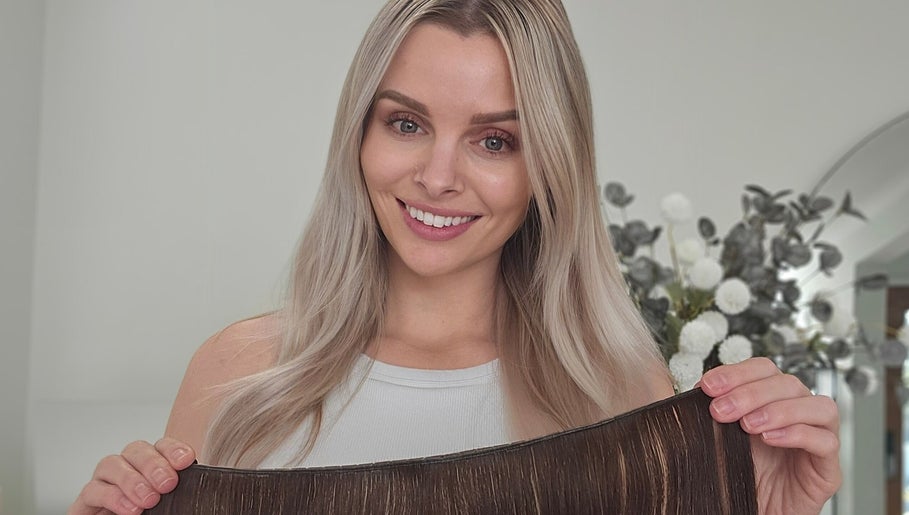 Woman showcasing hair extensions at Cascade Hair Extensions, Mount Warren Park, Queensland, AU.