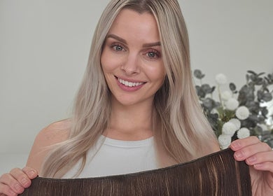 Woman showcasing hair extensions at Cascade Hair Extensions, Mount Warren Park, Queensland, AU.