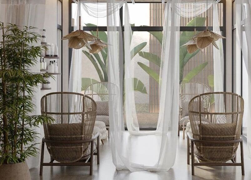 Relaxing lounge at Petanu Salon, Al Malqa', Al Qassim Province, SA with natural decor and soft lighting.