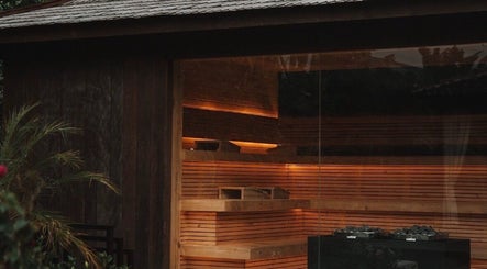 Warm wooden sauna at The Ark | Social Recovery Club, Bali, Bali, ID offers a relaxing atmosphere.