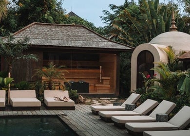 Relax by the serene poolside at The Ark | Social Recovery Club, Bali, Bali, ID, surrounded by lush greenery.