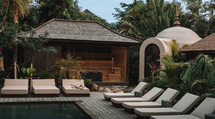 Relax by the serene poolside at The Ark | Social Recovery Club, Bali, Bali, ID, surrounded by lush greenery.