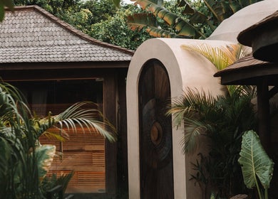 Entrancing architecture at The Ark | Social Recovery Club, Bali, Bali, ID surrounded by lush greenery.