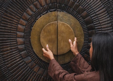 Intricately carved door at The Ark | Social Recovery Club in Bali, Bali, ID.