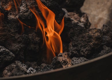 Glowing coals at The Ark | Social Recovery Club in Bali, Bali, ID. Fire adds warmth to the serene atmosphere.