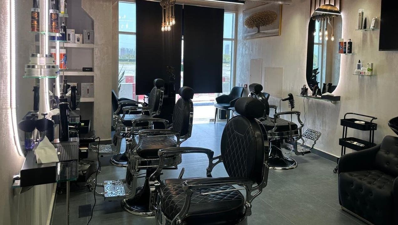 Elegant interior of The Classic Barber in Dubai, AE featuring modern barber chairs and chic decor.