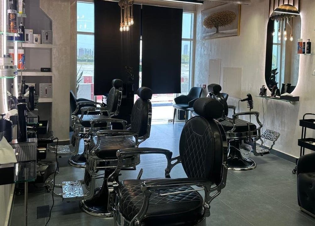 Elegant interior of The Classic Barber in Dubai, AE featuring modern barber chairs and chic decor.
