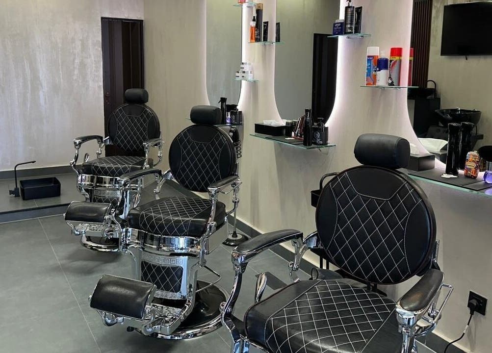 Luxurious barber chairs at The Classic Barber in Dubai, Dubai, AE, showcasing modern elegance and comfort.