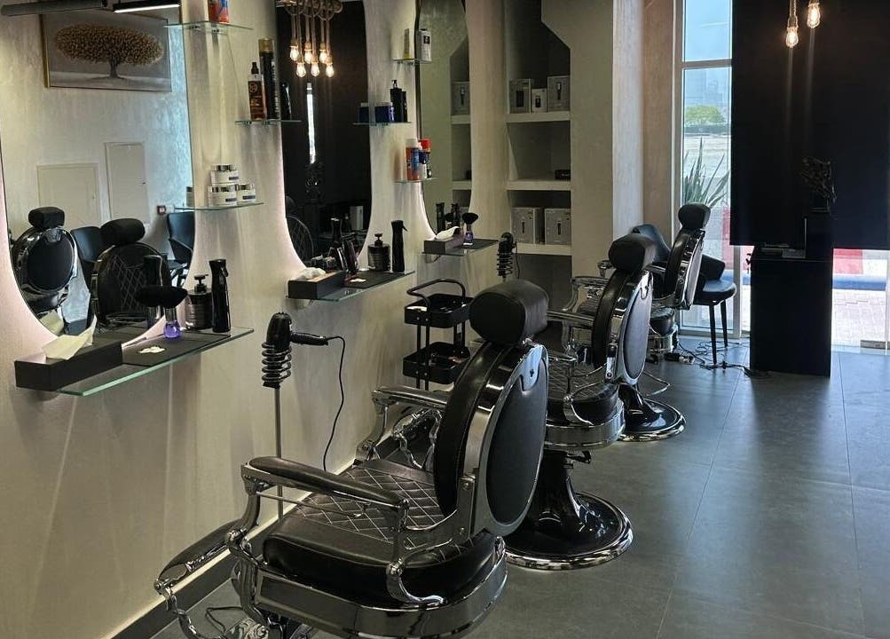 Modern interior of The Classic Barber in Dubai, Dubai, AE features sleek chairs and stylish decor.