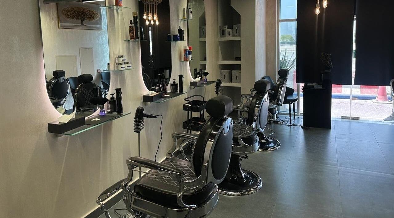 Modern interior of The Classic Barber in Dubai, Dubai, AE features sleek chairs and stylish decor.