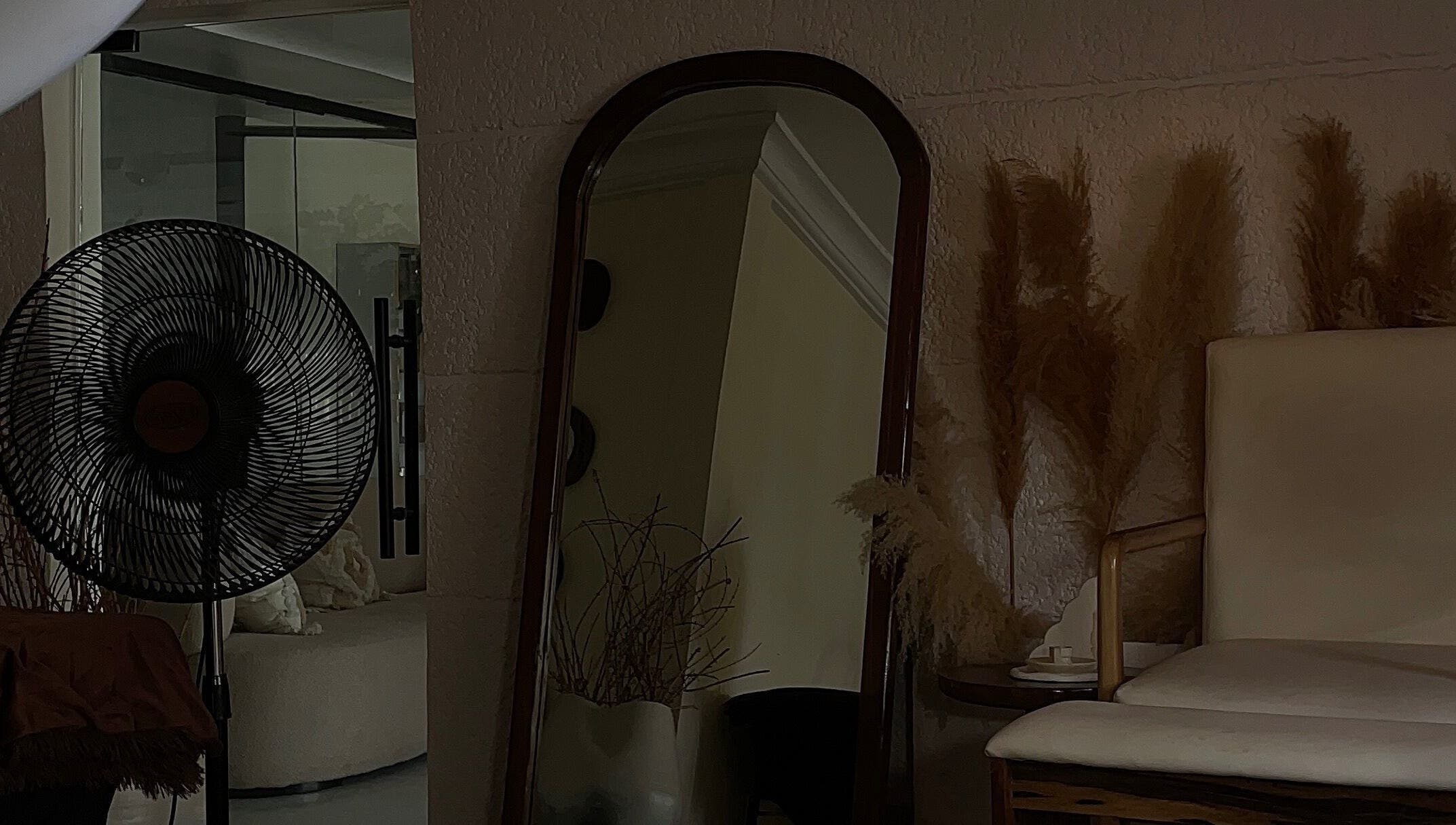 Elegant interior of 21stluxury.ng in Ikeja, Lagos, NG, featuring a mirror and chic decor elements.