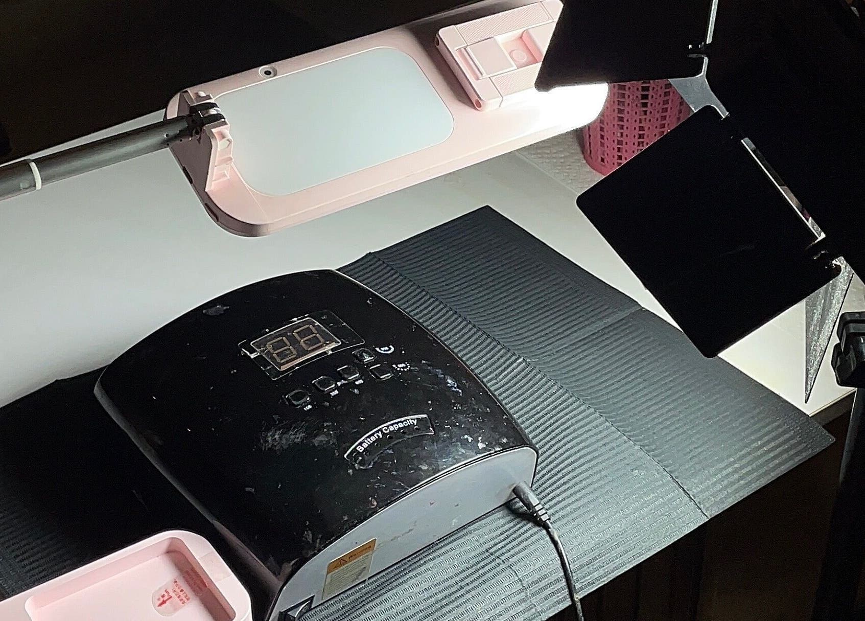 Professional salon setup at 21stluxury.ng, Ikeja, Lagos, NG featuring a nail drying station.