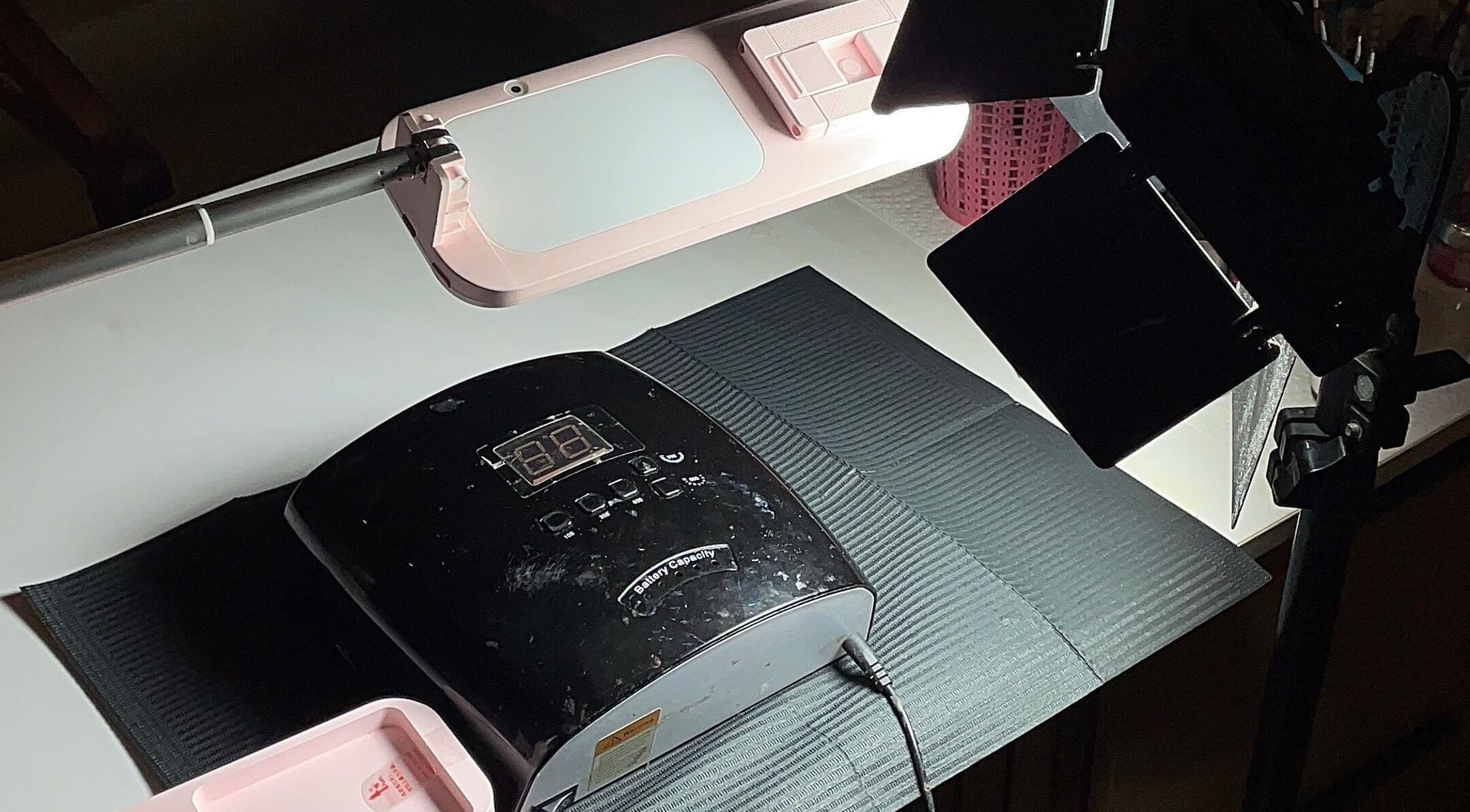 Professional salon setup at 21stluxury.ng, Ikeja, Lagos, NG featuring a nail drying station.