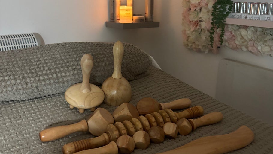 A serene spa setting at Skin Love Era, Maidstone, England, GB, showcasing elegant wooden massage tools.