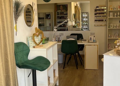 Elegant interior of Denise Makeup Artist & Beauty Therapist in Iż-żejtun, MT with makeup and skincare displays.