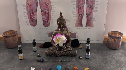 Tranquil Buddha statue with crystals at Just Breathe - CT Holistic Health & Wellness, Newton Abbot, England, GB.