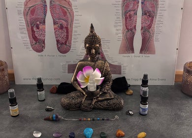Tranquil Buddha statue with healing crystals at Just Breathe - CT Holistic Health & Wellness, Newton Abbot, England, GB.
