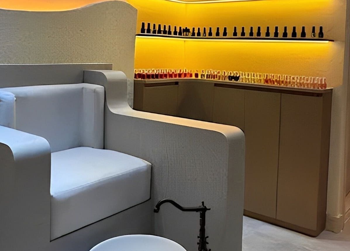 Cozy manicure and pedicure corner at Look & Love Beauty Salon, Dubai, Dubai, AE with stylish seating and polish display.