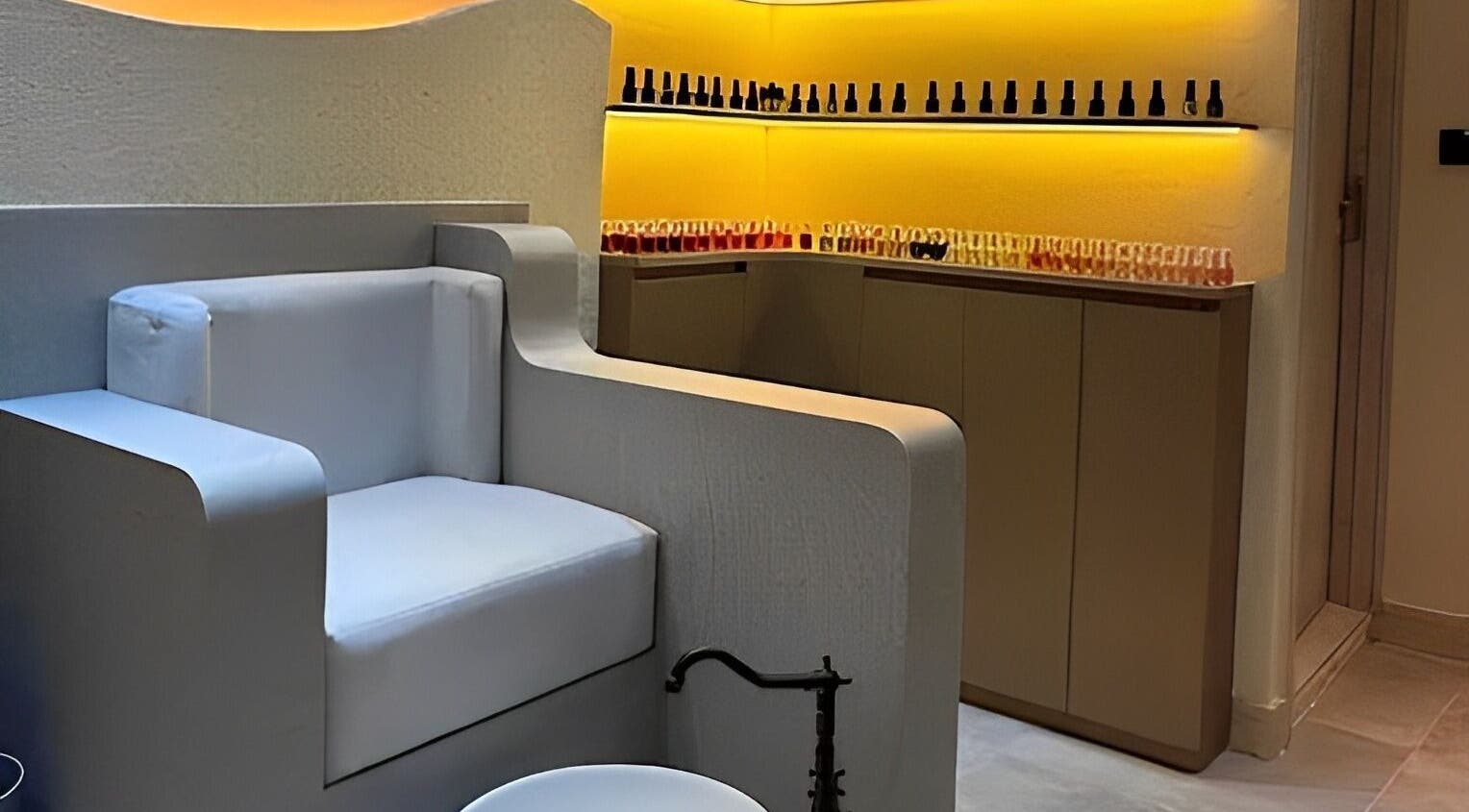 Cozy manicure and pedicure corner at Look & Love Beauty Salon, Dubai, Dubai, AE with stylish seating and polish display.