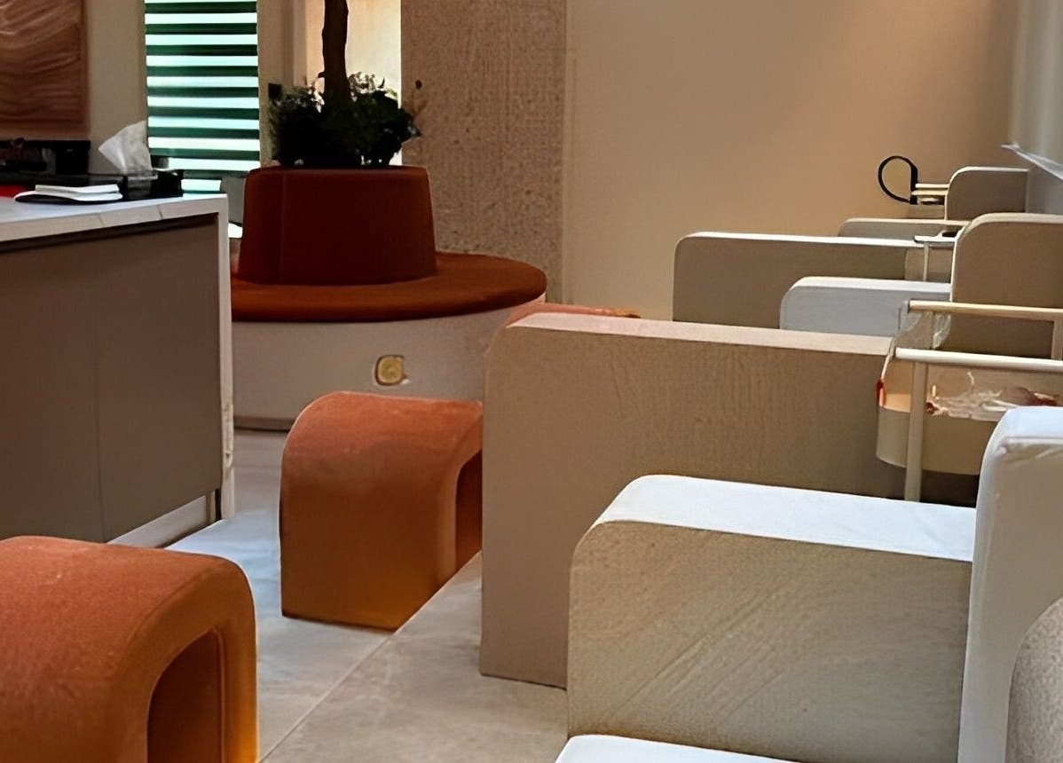 Modern interior of Look & Love Beauty Salon in Dubai, Dubai, AE with elegant seating and ambient lighting.