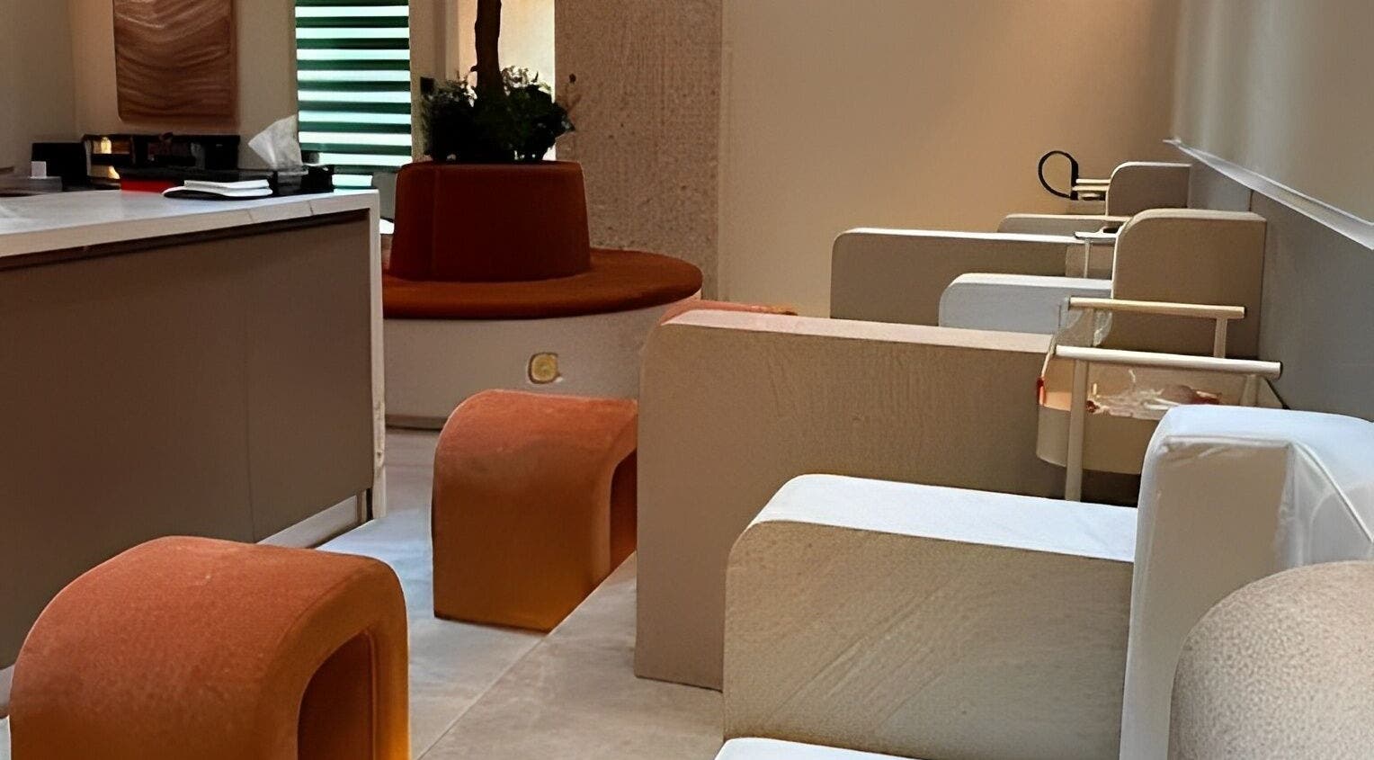 Modern interior of Look & Love Beauty Salon in Dubai, Dubai, AE with elegant seating and ambient lighting.