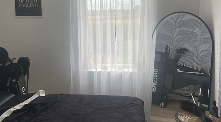 Tranquil therapy room at Shape & Sculpt with Grace, Liverpool, England, GB with natural light and cozy decor.