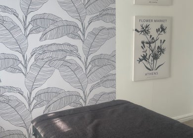 Cozy spa room at Shape & Sculpt with Grace, Liverpool, England, GB, featuring calming leaf artwork.