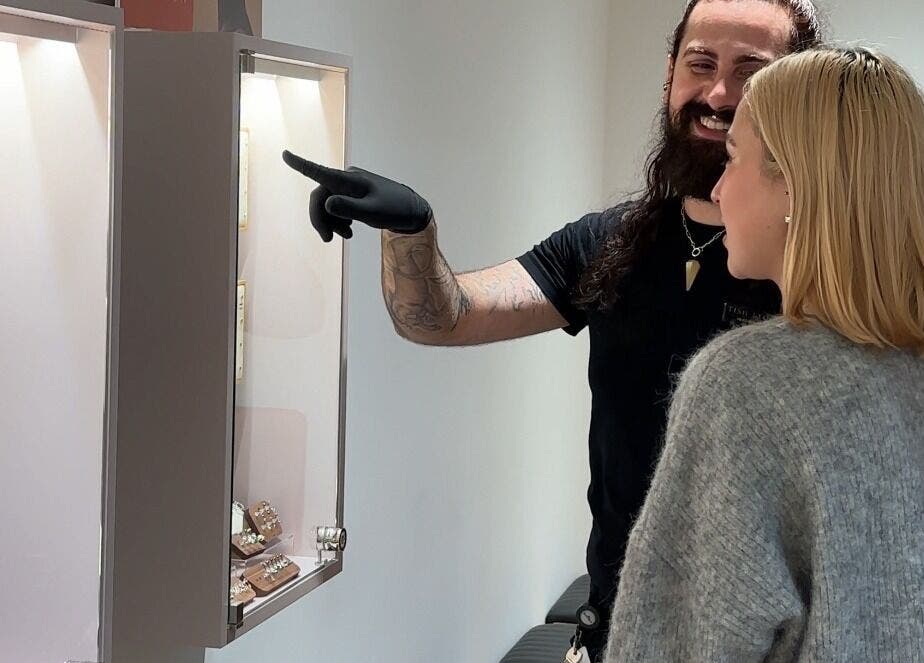 A client explores jewelry with guidance at Tish Lyon, London, England, GB.