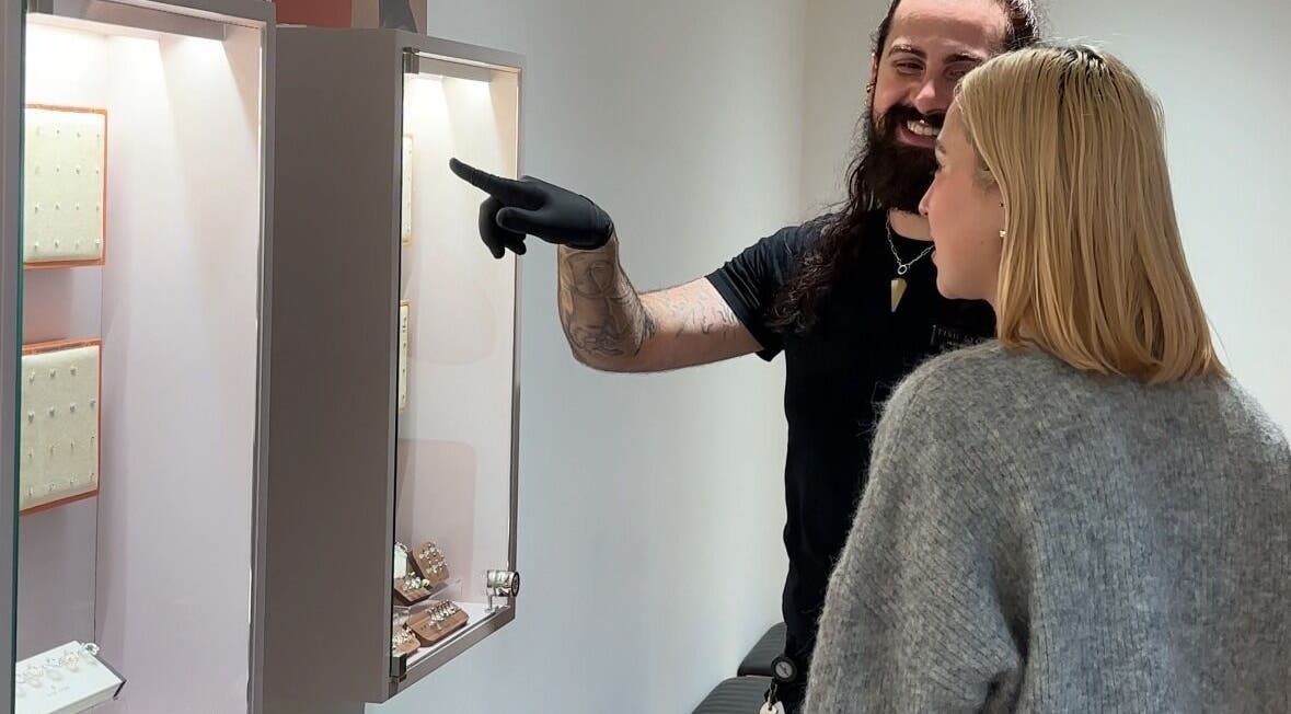 A client explores jewelry with guidance at Tish Lyon, London, England, GB.