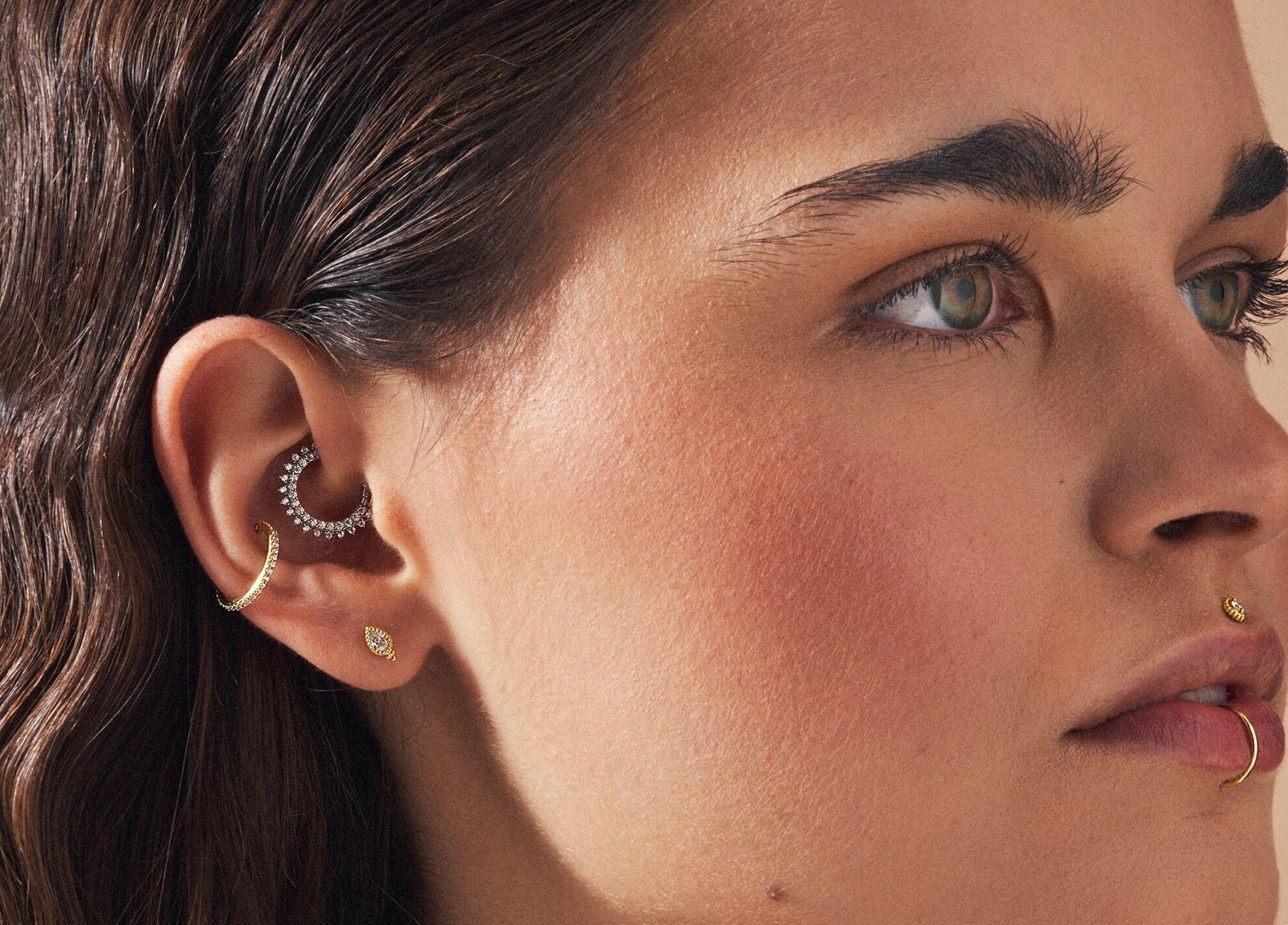 Close-up of a person with stylish piercings at Tish Lyon, London, England, GB.