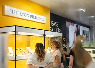Customers admire jewelry at Tish Lyon Luxury Piercing & Jewellery Studio - Liverpool, England, GB.