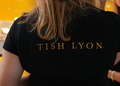 Tish Lyon Luxury Piercing & Jewellery Studio staff in logo t-shirt, Liverpool, England, GB.