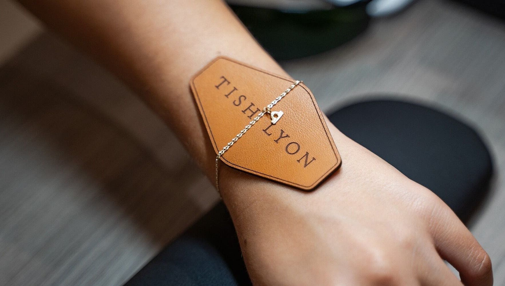 Elegant bracelet with Tish Lyon logo, at Tish Lyon Luxury Piercing & Jewellery Studio - Bluewater, Dartford, England, GB.