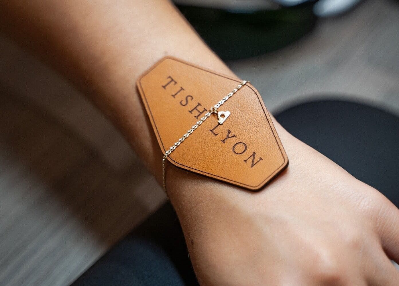 Elegant bracelet with Tish Lyon logo, at Tish Lyon Luxury Piercing & Jewellery Studio - Bluewater, Dartford, England, GB.