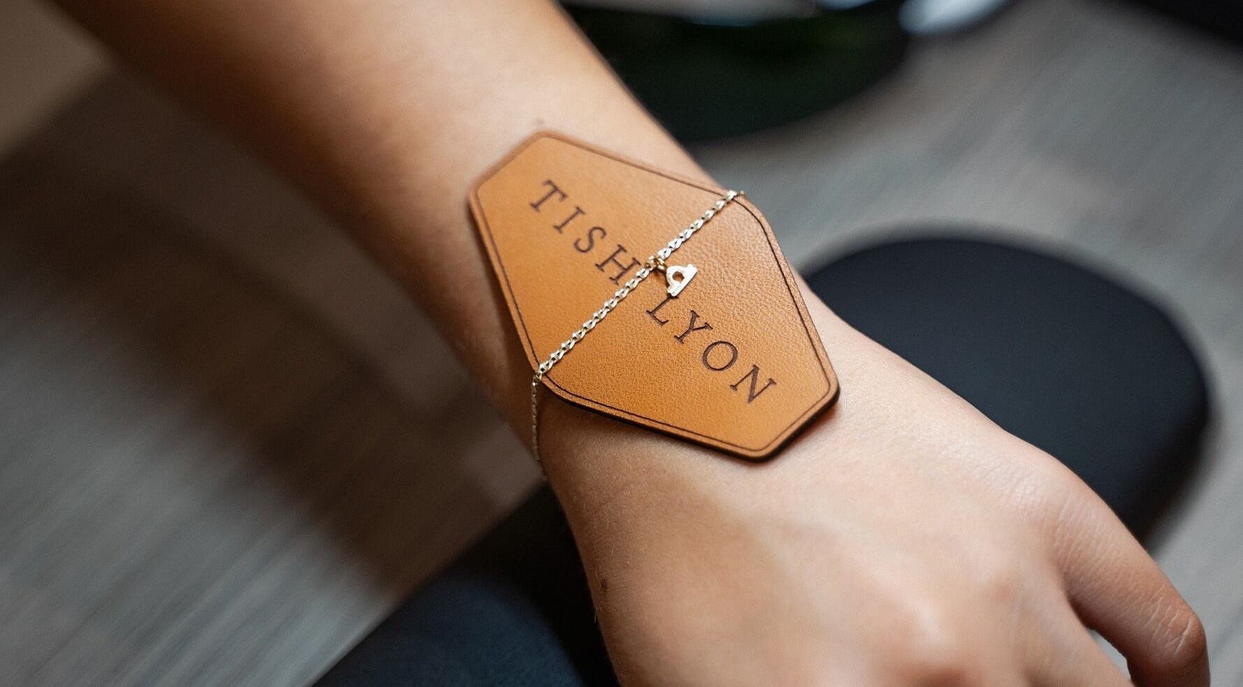 Elegant bracelet with Tish Lyon logo, at Tish Lyon Luxury Piercing & Jewellery Studio - Bluewater, Dartford, England, GB.